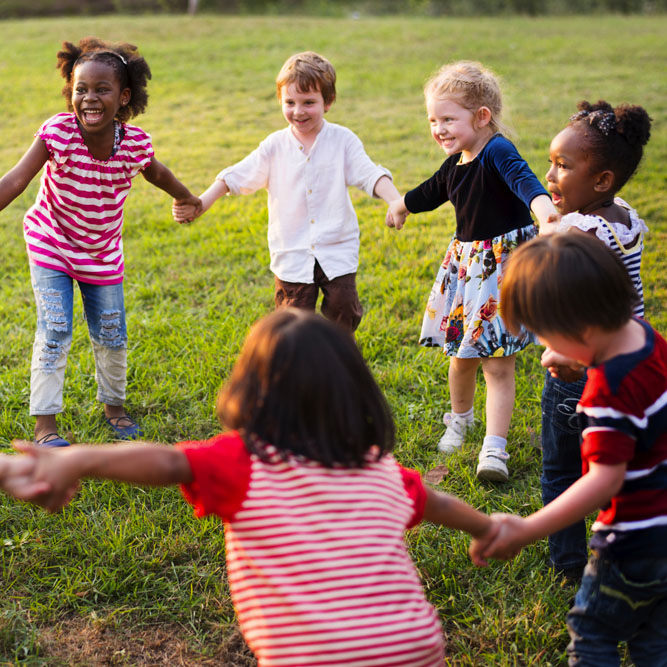 Group of Diverse Kids Playing at the Field Together
